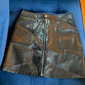 Faux black leather skirt with zipper detail down middle